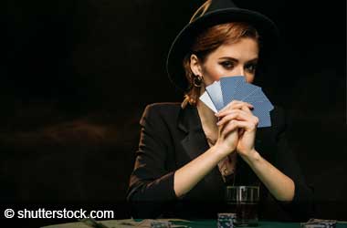woman bluffing playing poker